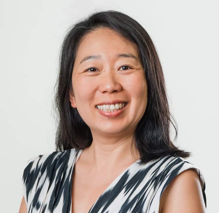 Teacher Mini smiling for a professional portrait